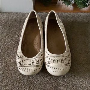 white patterned flats